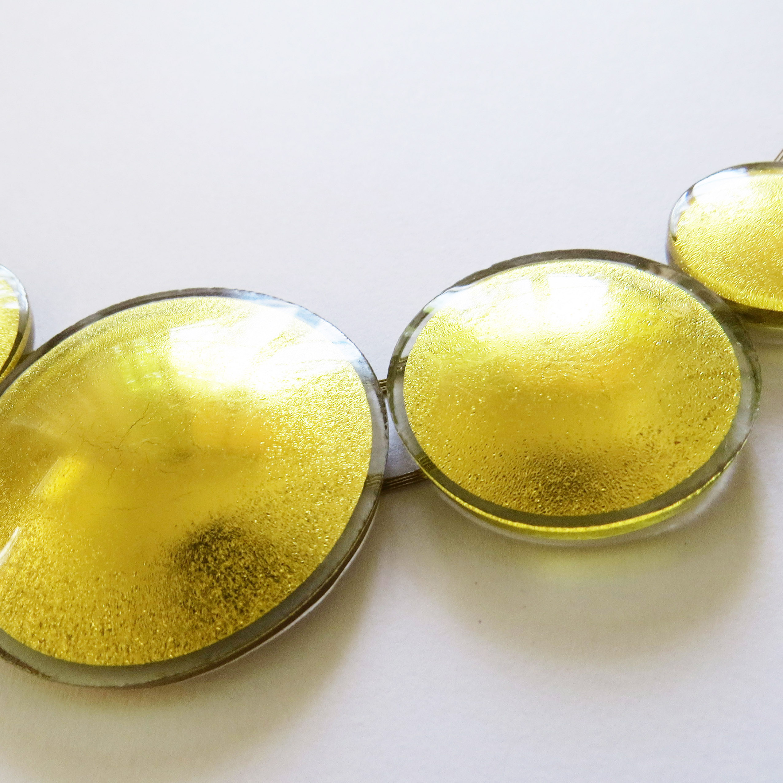 Sun necklace (SN5), made of five suns in 2, 3 and 4 cm, 45 cm circumference, which can get prolonged on request.
