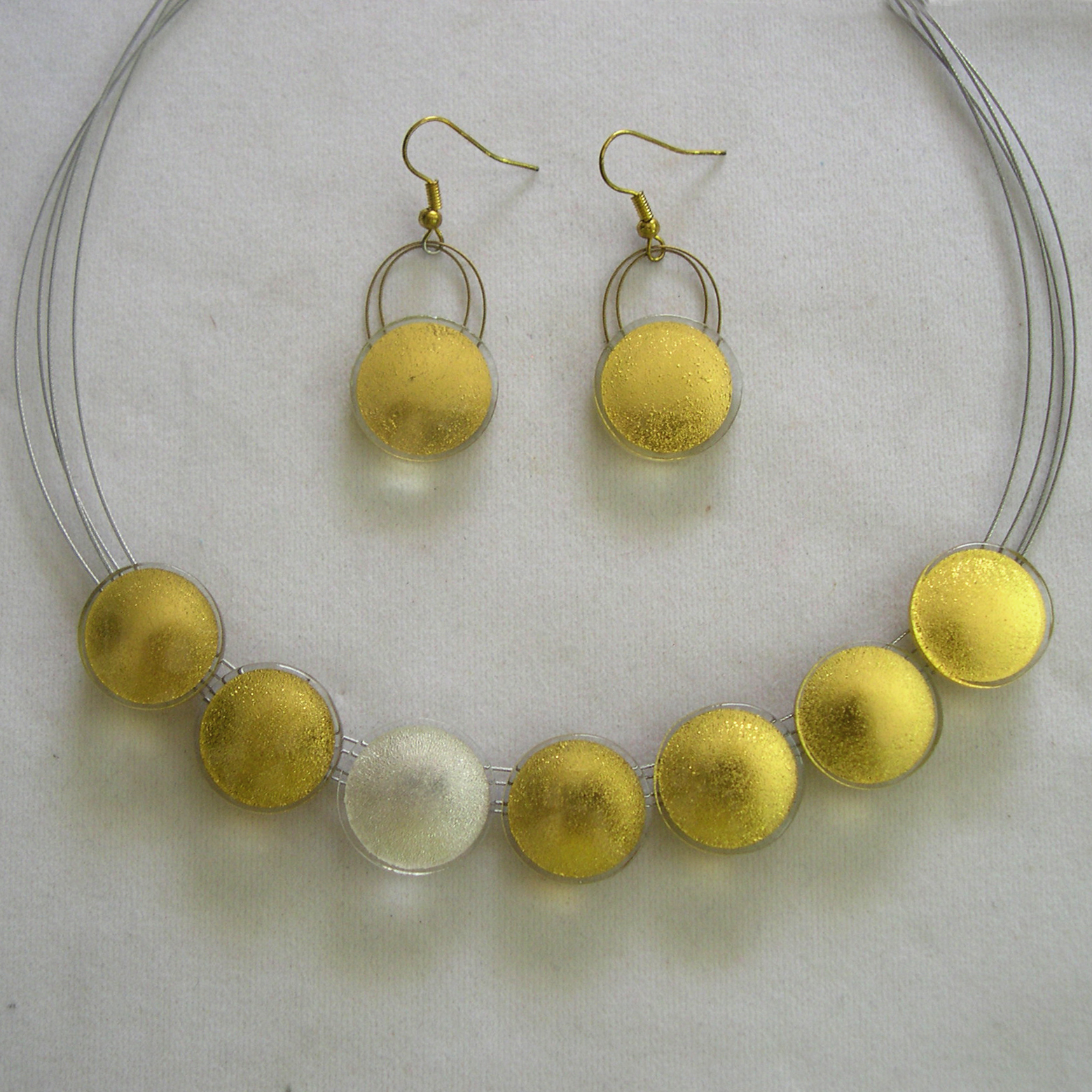 Sun necklace (SN72), 7 suns in 2 cm, 45 cm circumference, which can get prolonged on request, hanging earrings 2 cm (S2EH)