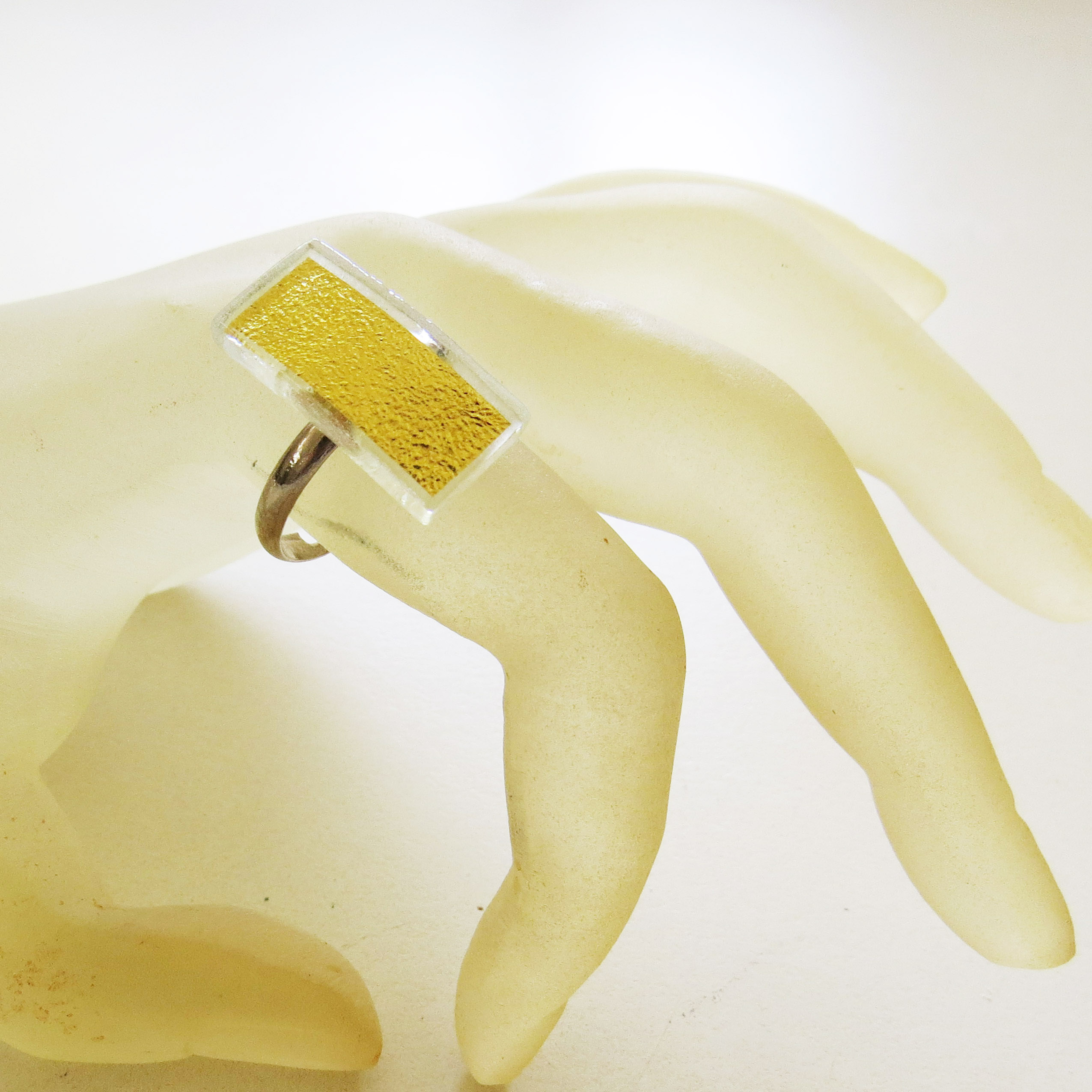 Small rectangular ring (L0R) 2 x 0.9 cm, all our rings have an adjustable fitting which can get adapted to every finger.