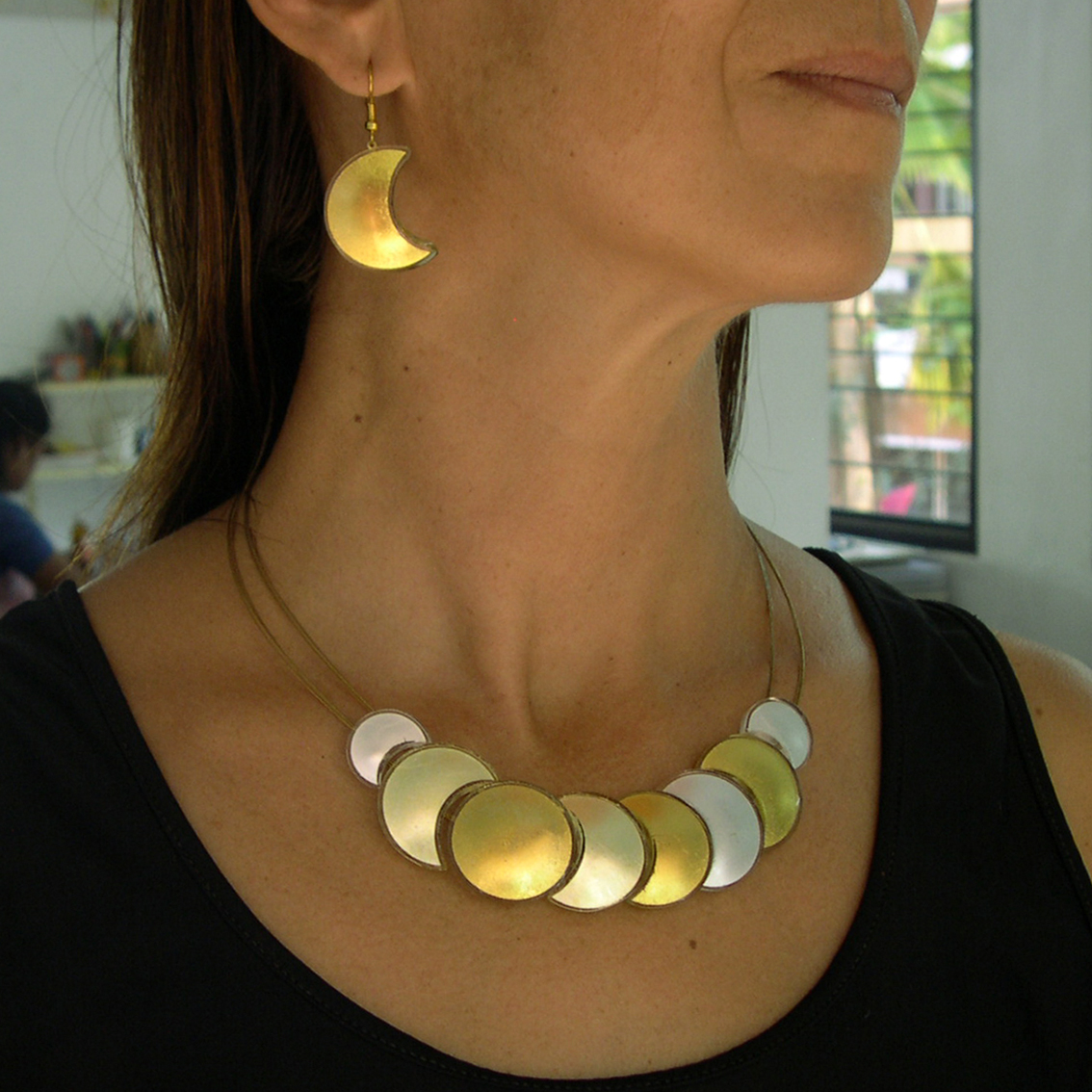 Moon & Sun necklace (MSN8y) and Moon earrings (M3EH)As they are all made by hand, they come always different and we are not able to update the site or send them online. You would need to come and select yourself.