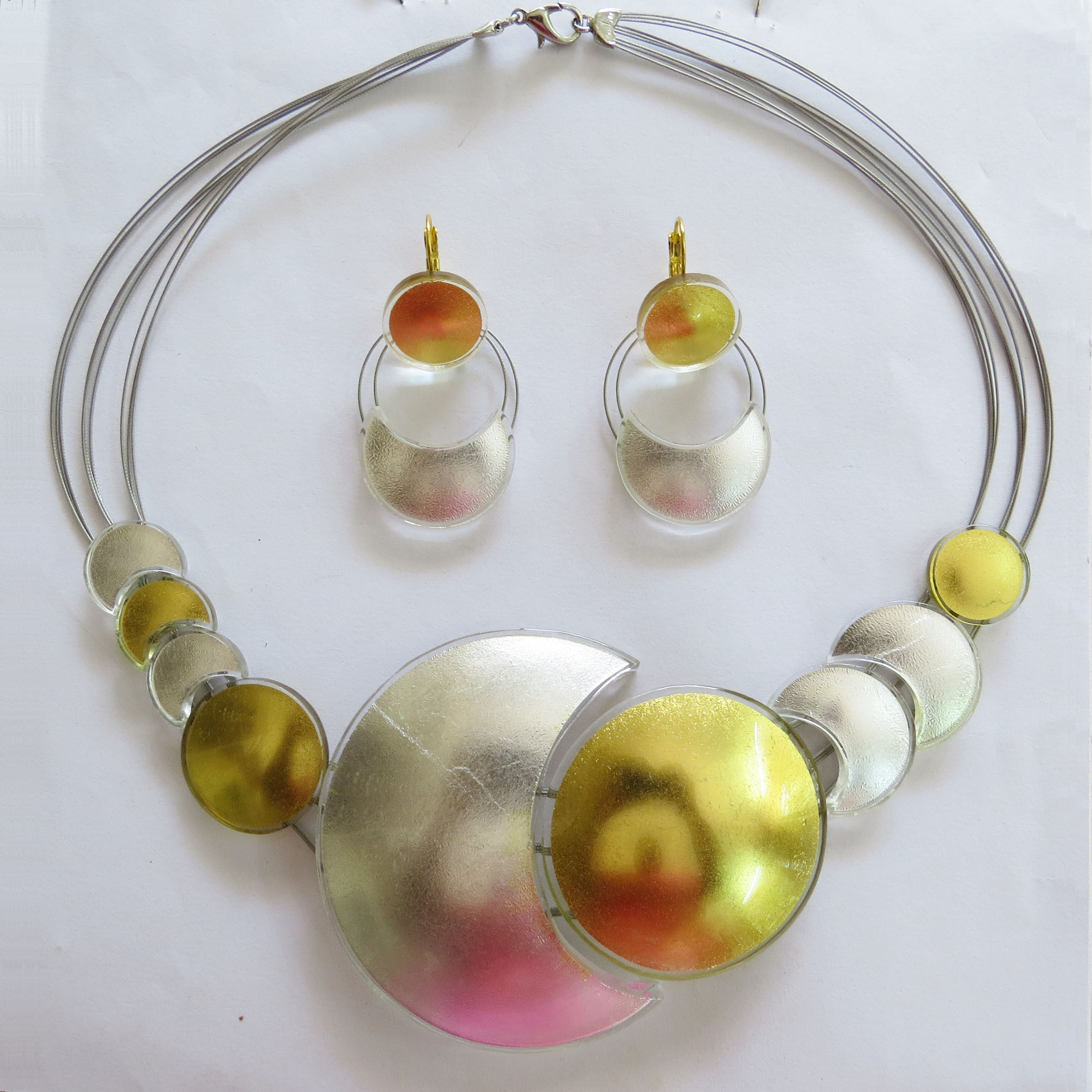 Moon & Sun necklace (MSNbig) and combined Moon & Sun earrings (MSEH)Our gold, white gold and silver-in-glass pieces will never tarnish, as the precious metal is encased forever safely inside of the glass vacuum.